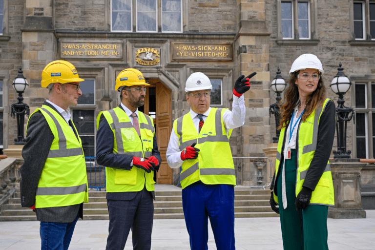 University of Edinburgh employees show Scotland's First Minister the EFI building works.